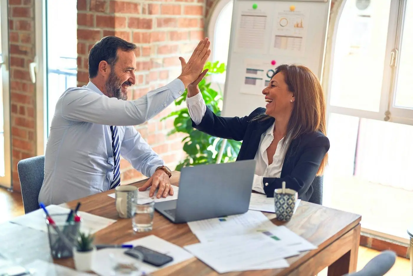 Partners celebrating a deal
